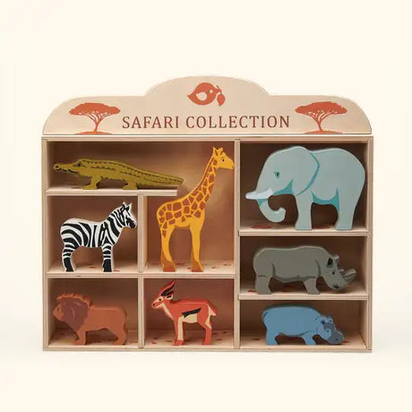 Wooden safari animals on some rocks